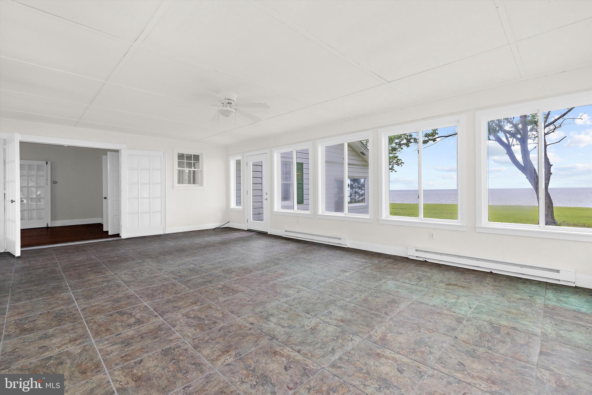 500 Nesbit Road Queenstown, MD 21658 - Photo 16 of 53 an empty room with windows