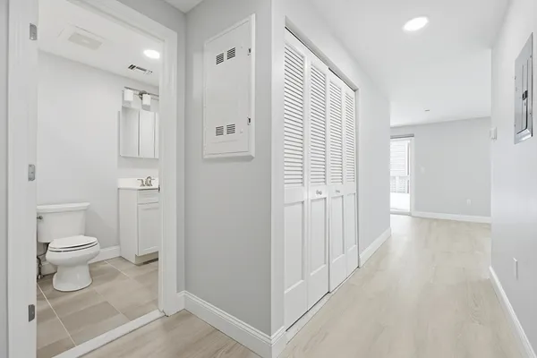 a bathroom with a toilet a sink and shower