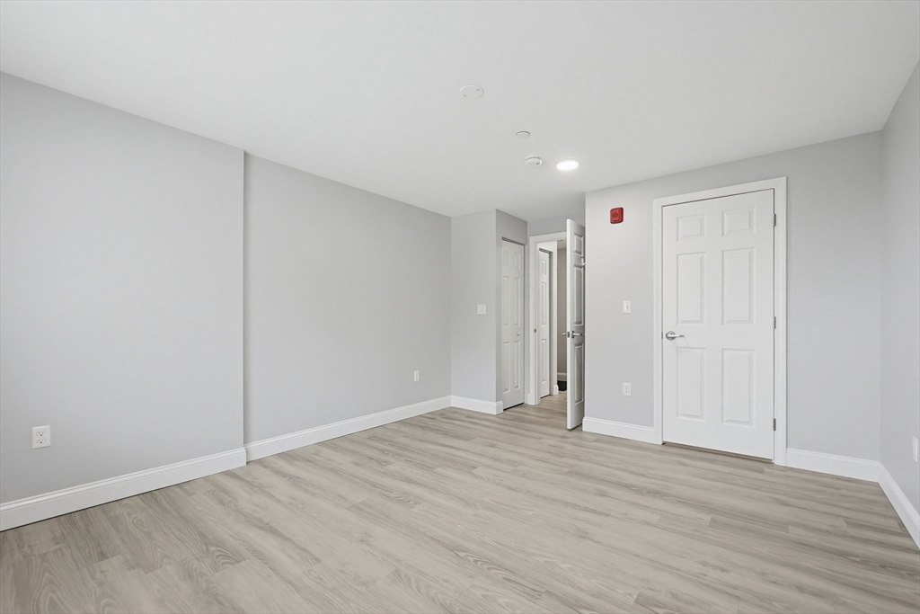 212 Franklin Crossing Road, Unit 12 Franklin, MA 02038 - Photo 4 of 11 a view of an empty room