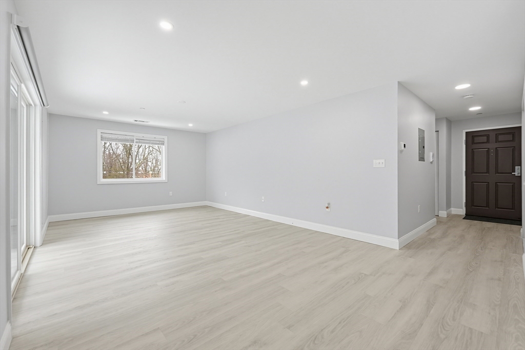 212 Franklin Crossing Road, Unit 12 Franklin, MA 02038 - Photo 6 of 11 an empty room with a empty space and window