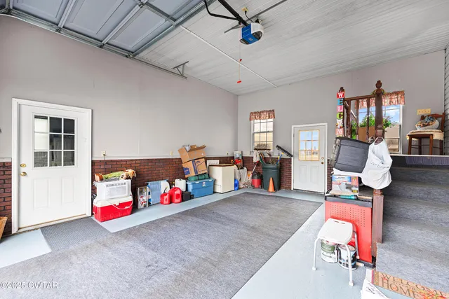 a living room with furniture and gym equipment