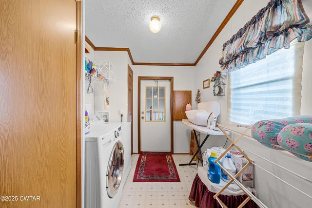 a utility room with wooden floor and furniture