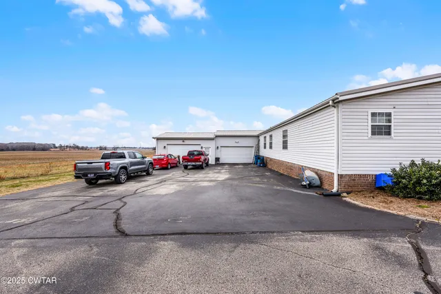 a view of a cars park in front of house