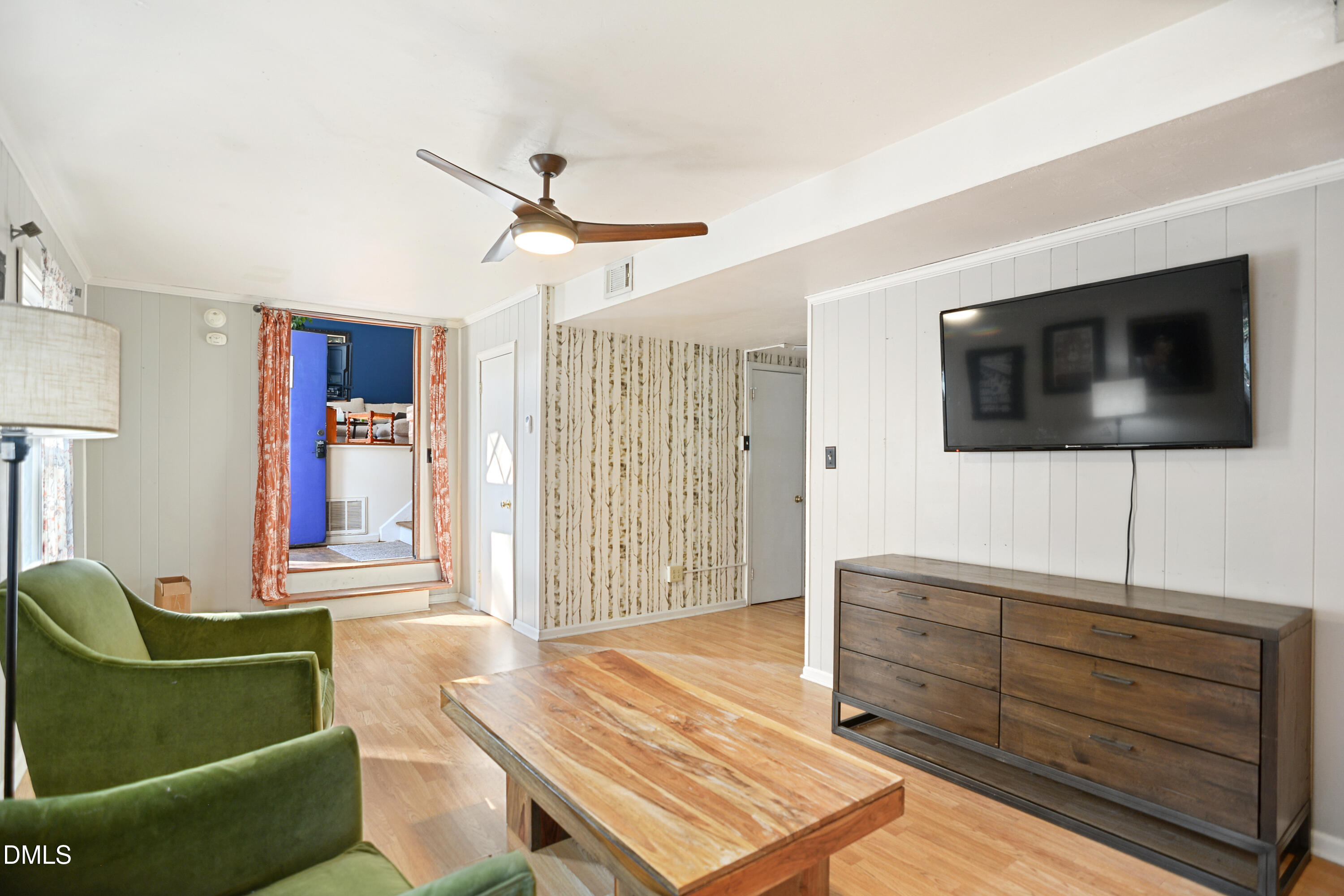 1421 Lions Way Raleigh, NC 27604 - Photo 14 of 22 a living room with furniture and a flat screen tv