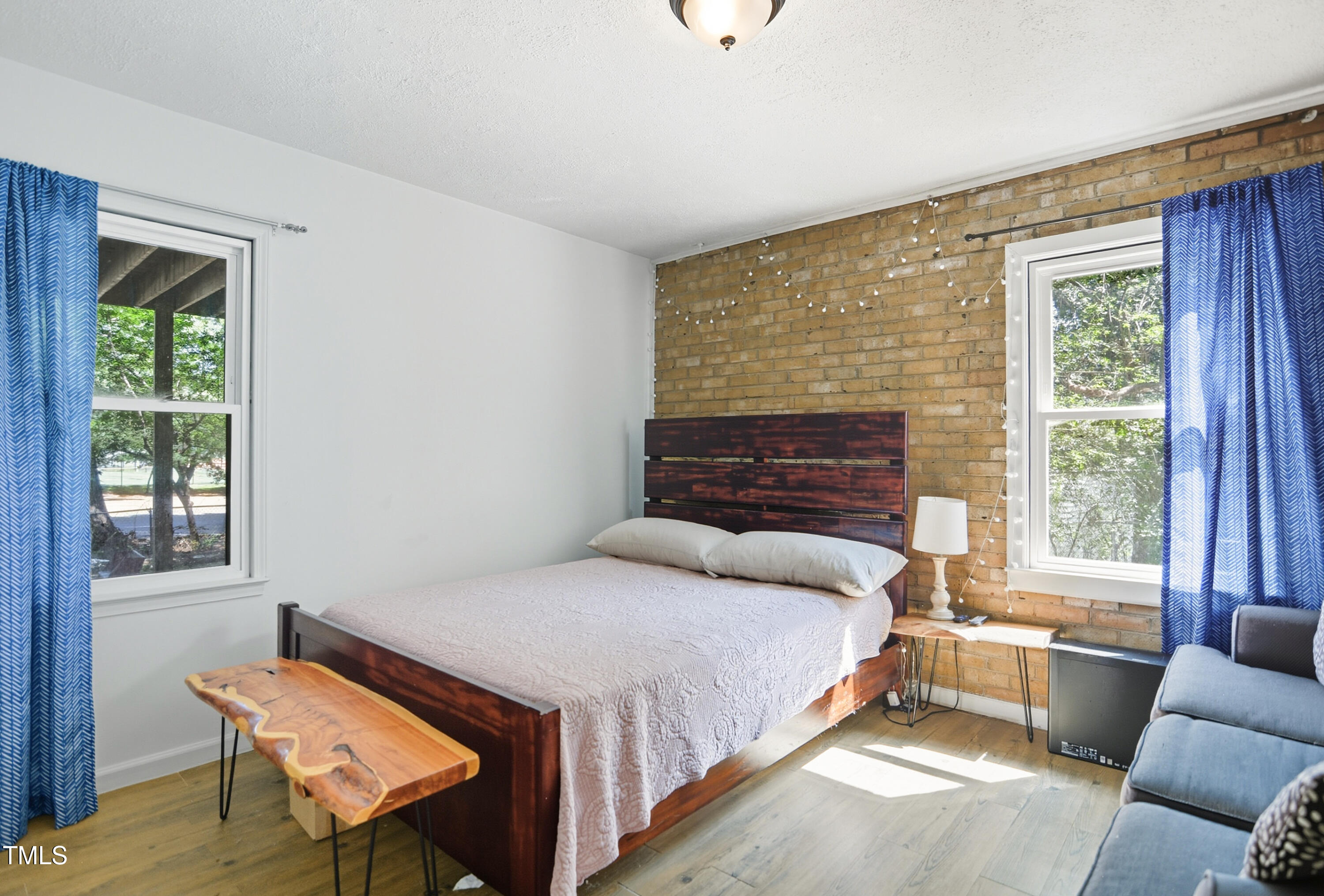1421 Lions Way Raleigh, NC 27604 - Photo 15 of 22 a bedroom with a bed and windows