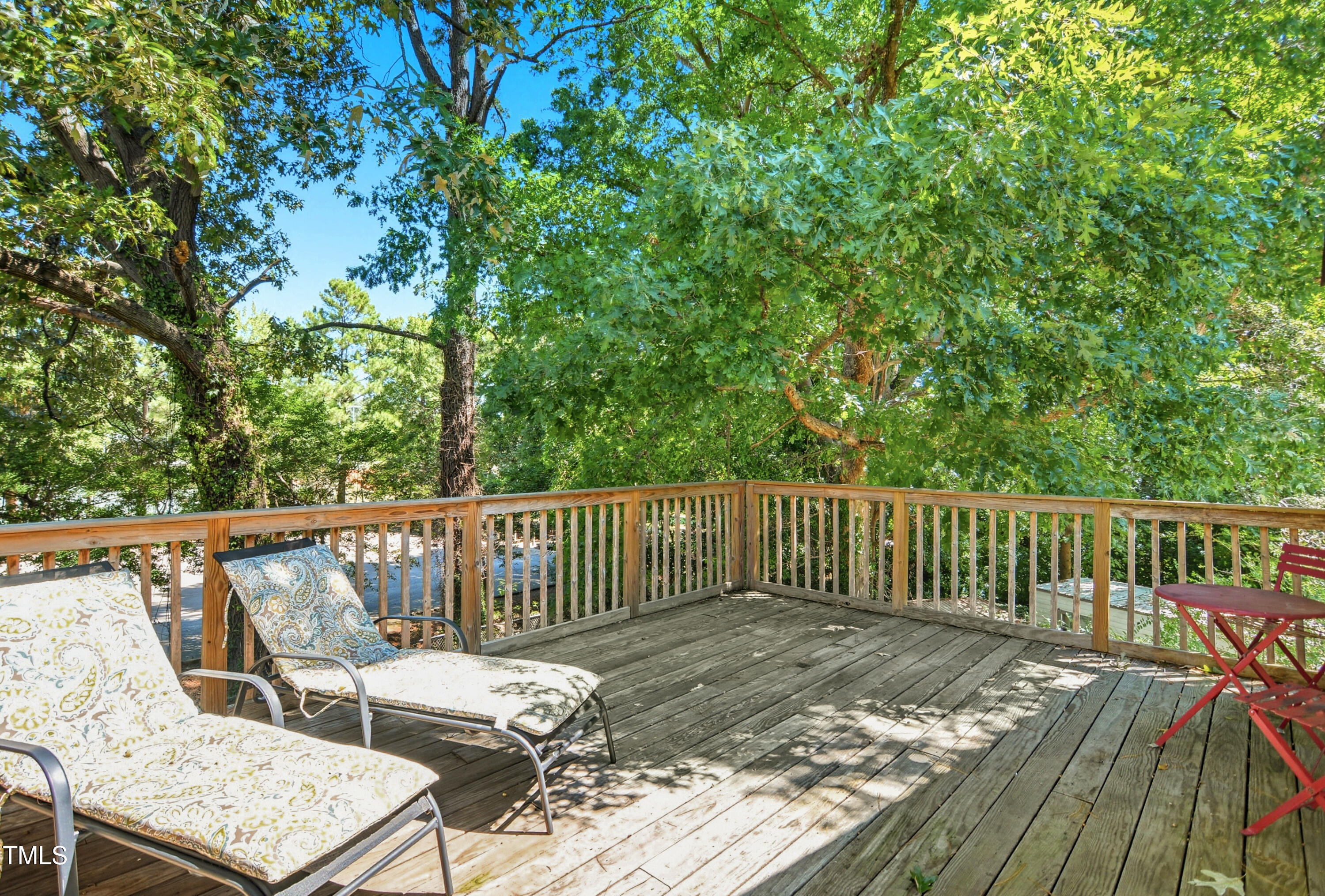 1421 Lions Way Raleigh, NC 27604 - Photo 17 of 22 a view of balcony with wooden floor and outdoor seating