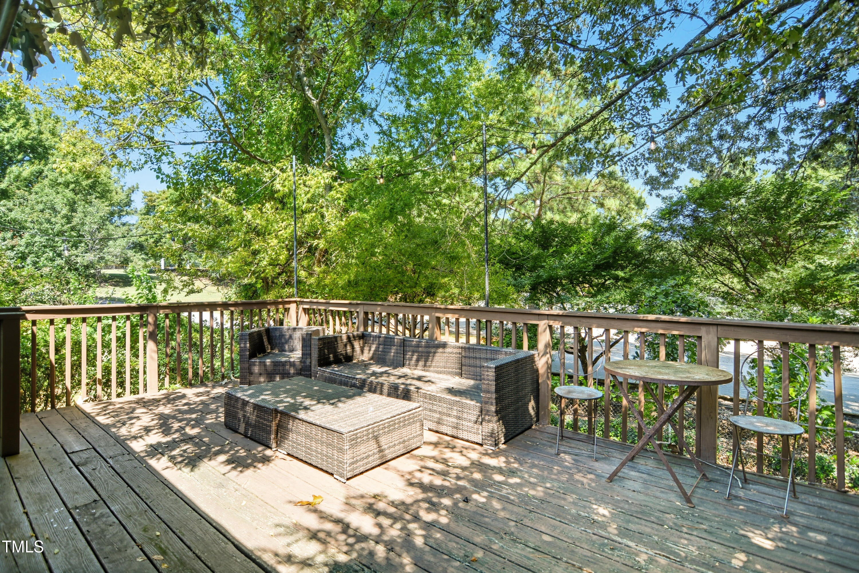 1421 Lions Way Raleigh, NC 27604 - Photo 18 of 22 a balcony with wooden floor and fence