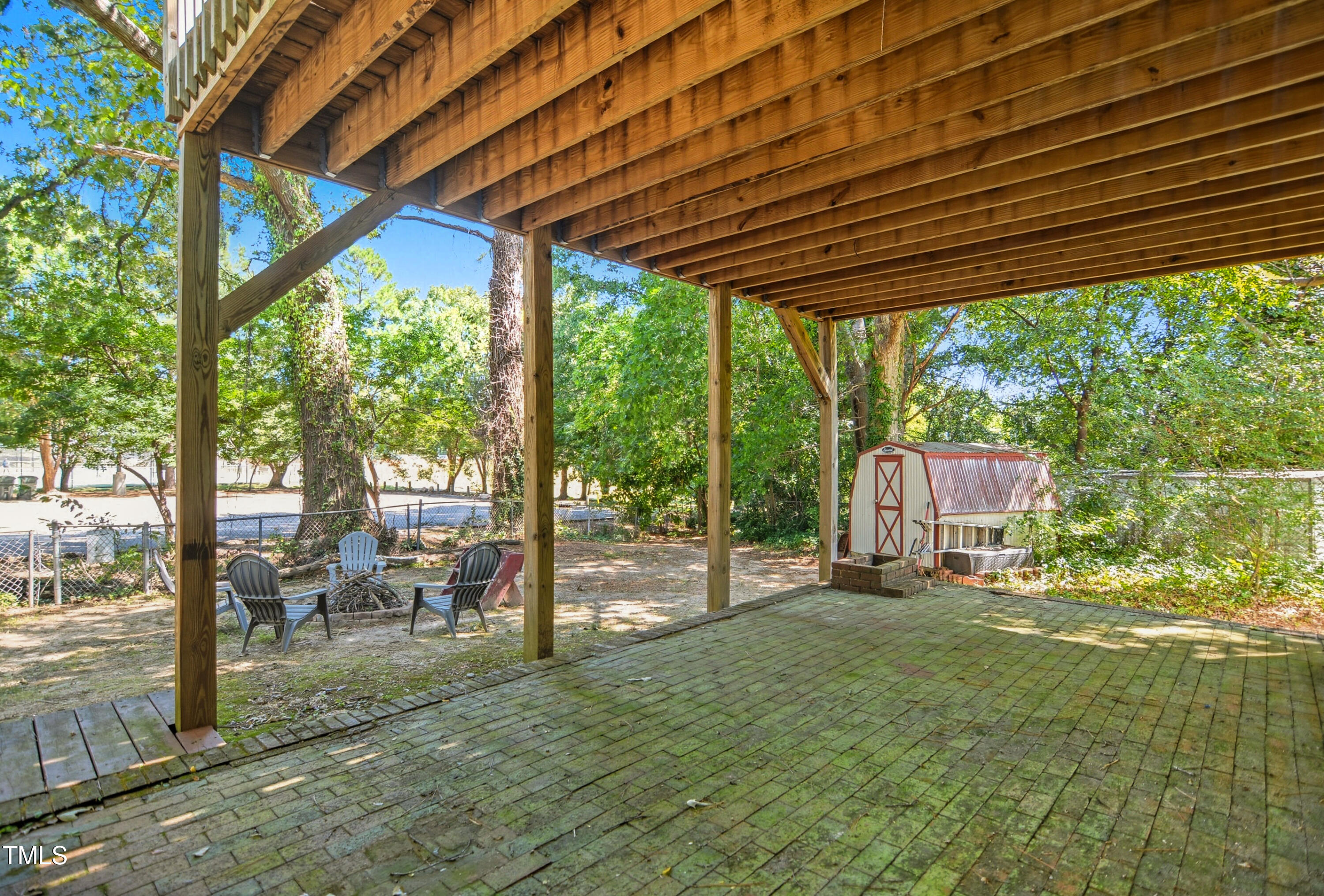 1421 Lions Way Raleigh, NC 27604 - Photo 20 of 22 a backyard of a house with table and chairs