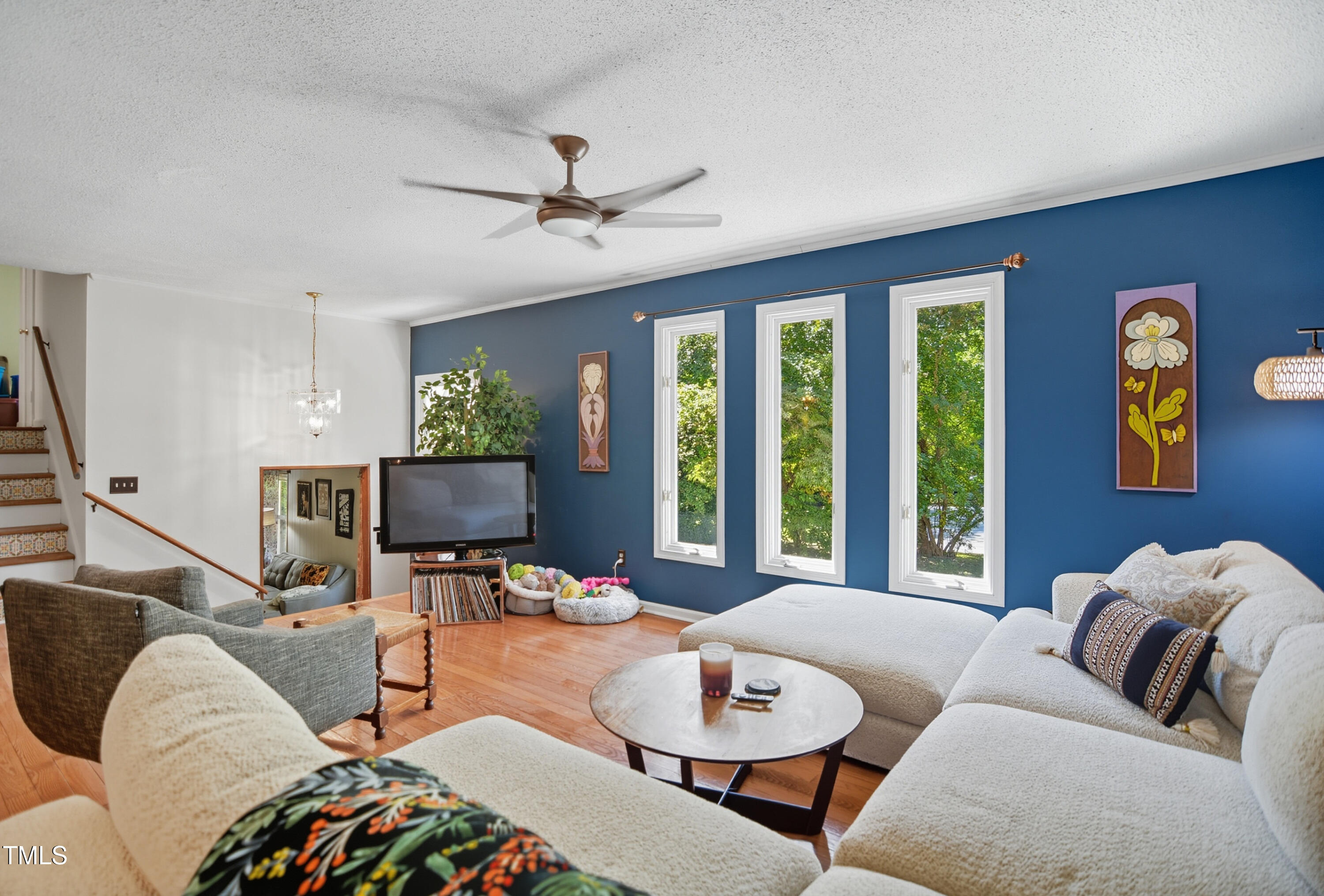 1421 Lions Way Raleigh, NC 27604 - Photo 4 of 22 a living room with furniture and a flat screen tv