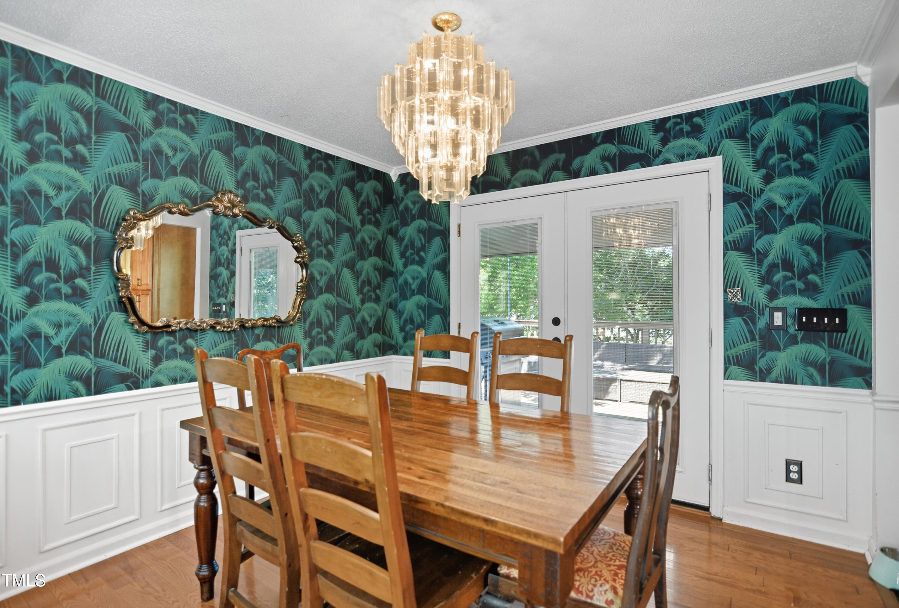 1421 Lions Way Raleigh, NC 27604 - Photo 5 of 22 a dining room with furniture a window and a chandelier