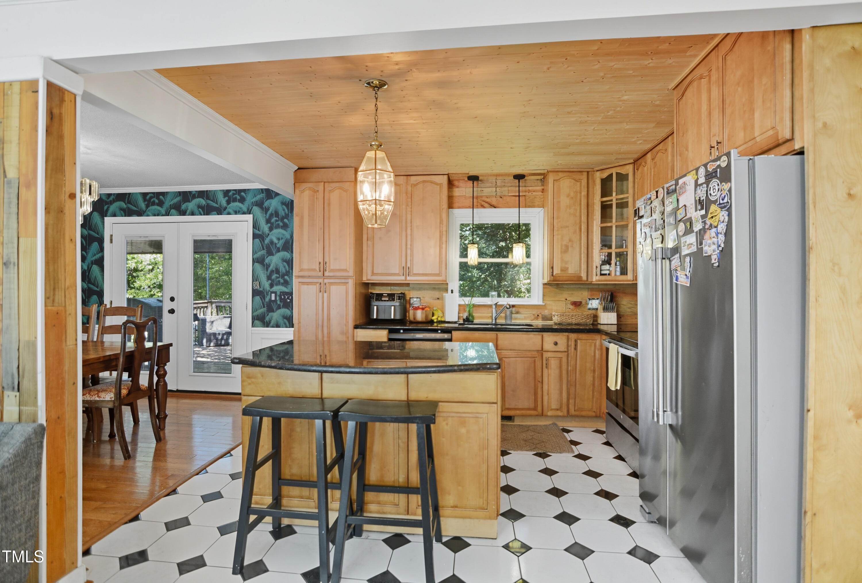 1421 Lions Way Raleigh, NC 27604 - Photo 7 of 22 a kitchen with stainless steel appliances a dining table chairs and chandelier