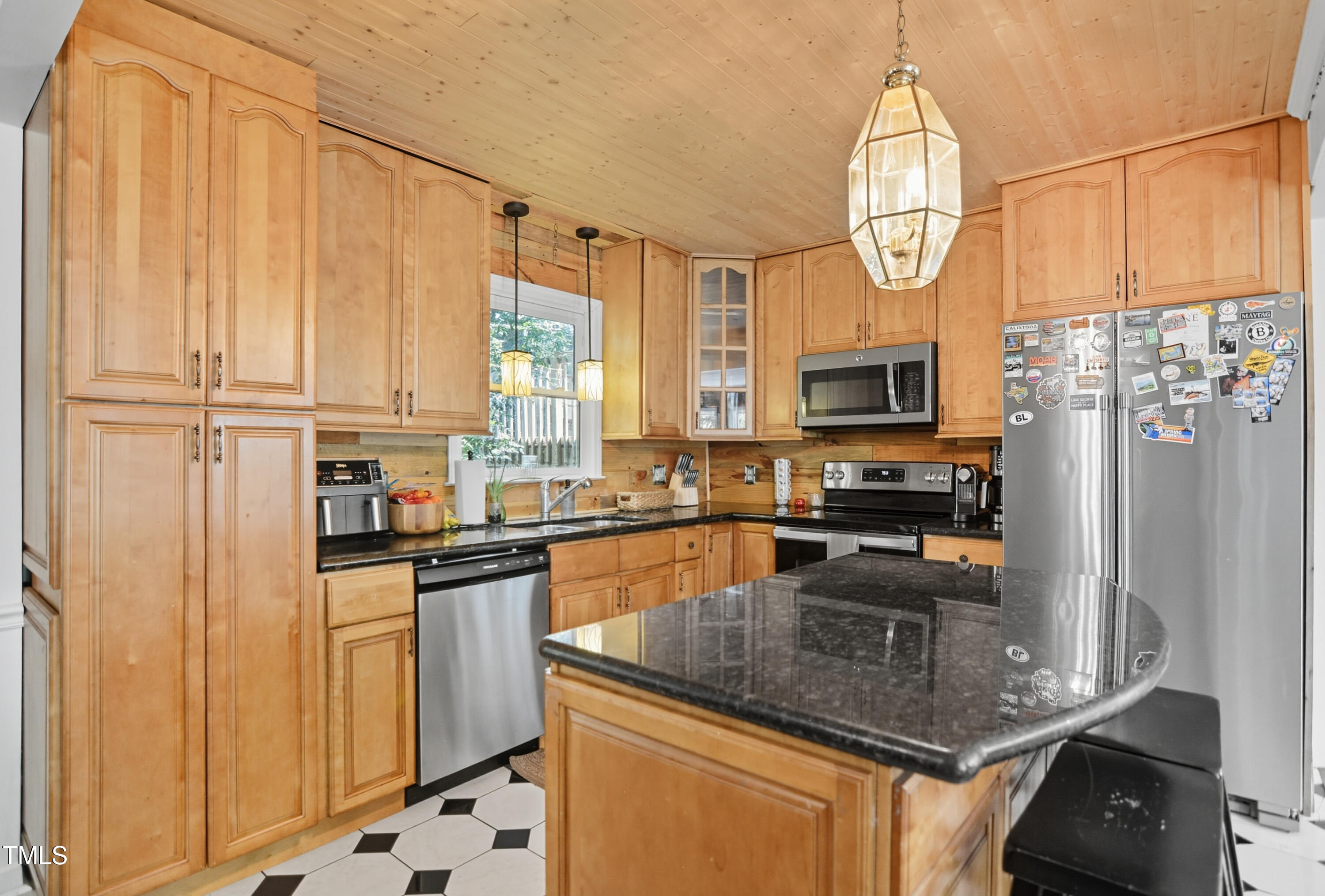1421 Lions Way Raleigh, NC 27604 - Photo 8 of 22 a kitchen with stainless steel appliances granite countertop a stove a sink and a refrigerator