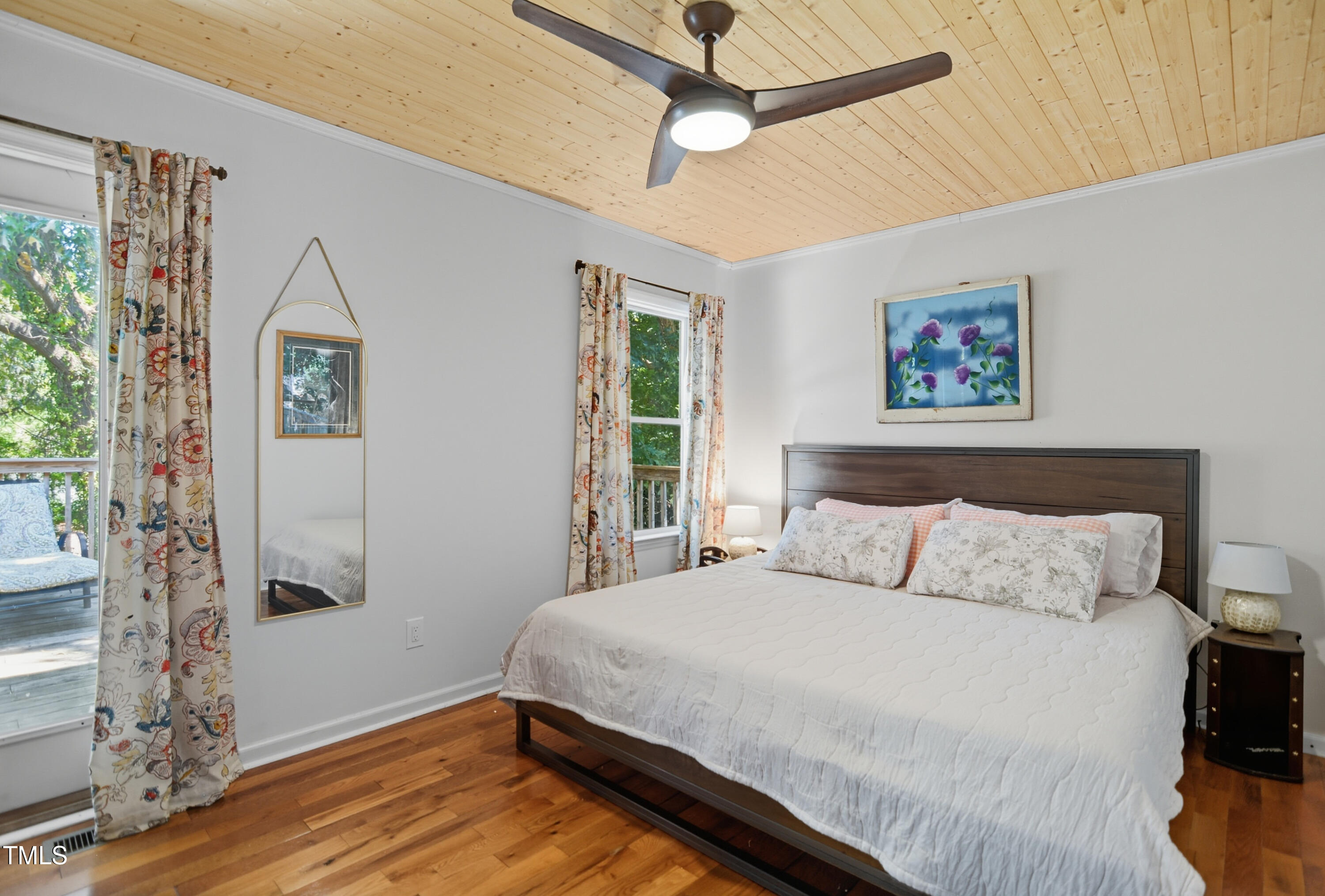 1421 Lions Way Raleigh, NC 27604 - Photo 10 of 22 a bedroom with a large bed and a window