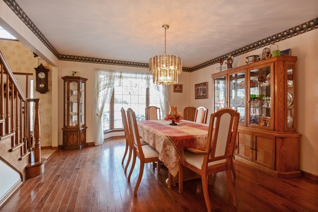 11445 Hummingbird Lane Mokena, IL 60448 - Photo 3 of 10 a view of a dining room with furniture window and wooden floor