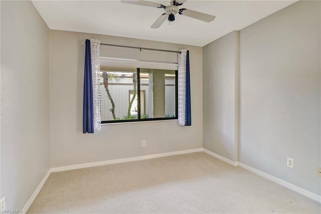 5809 Rattlesnake Hammock Road, Unit 102 Naples, FL 34113 - Photo 16 of 23 an empty room with a window