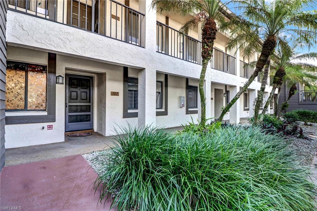 5809 Rattlesnake Hammock Road, Unit 102 Naples, FL 34113 - Photo 19 of 23 front view of a building