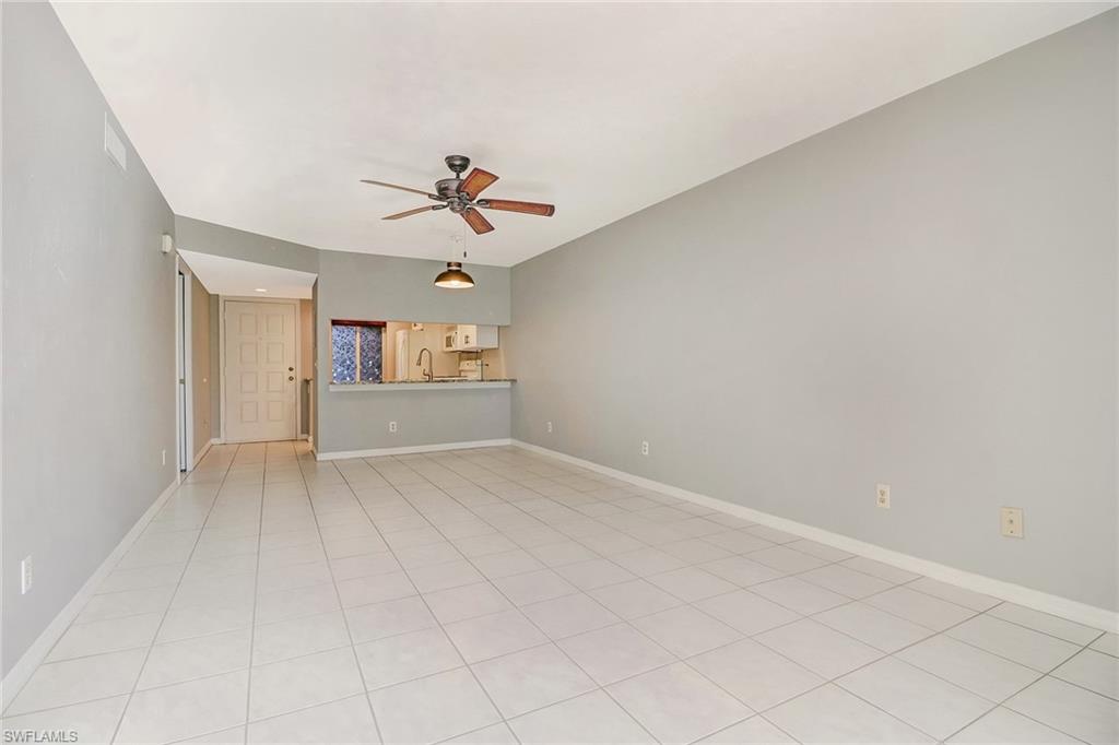 5809 Rattlesnake Hammock Road, Unit 102 Naples, FL 34113 - Photo 6 of 23 a view of an empty room with a window