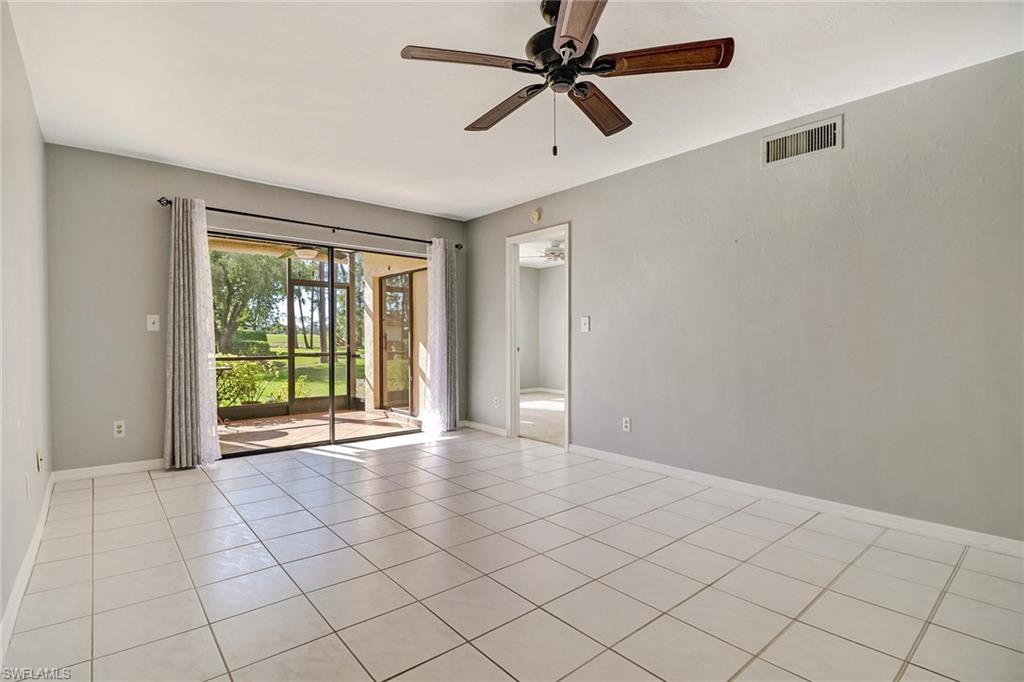 5809 Rattlesnake Hammock Road, Unit 102 Naples, FL 34113 - Photo 7 of 23 a view of an empty room and window fan