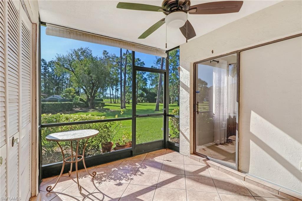 5809 Rattlesnake Hammock Road, Unit 102 Naples, FL 34113 - Photo 9 of 23 a very nice looking room with a large window and a porch
