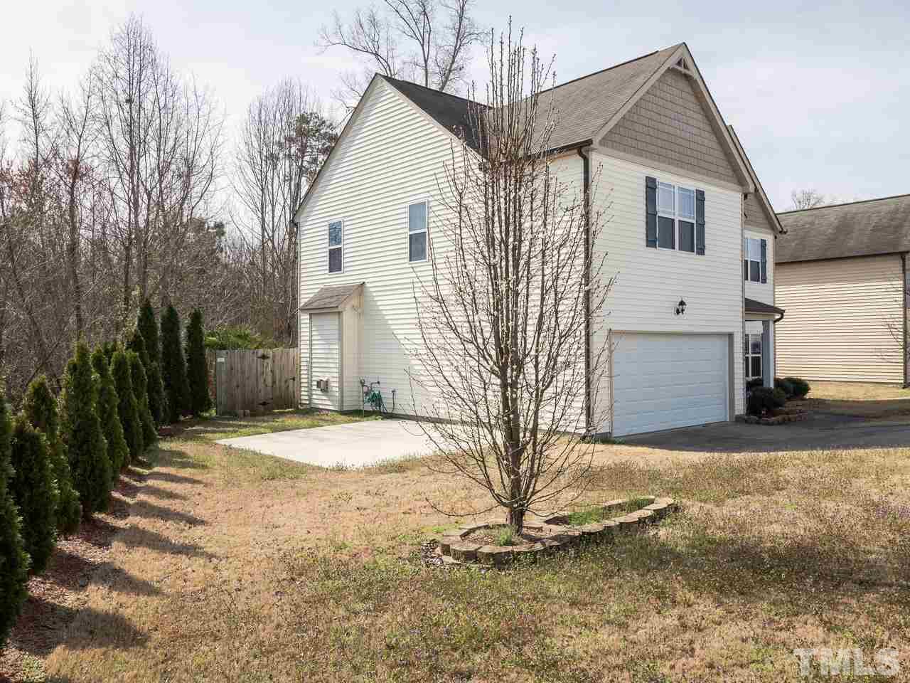 5624 Quitman Trail Raleigh, NC 27610 - Photo 2 of 25 a view of a house with a yard
