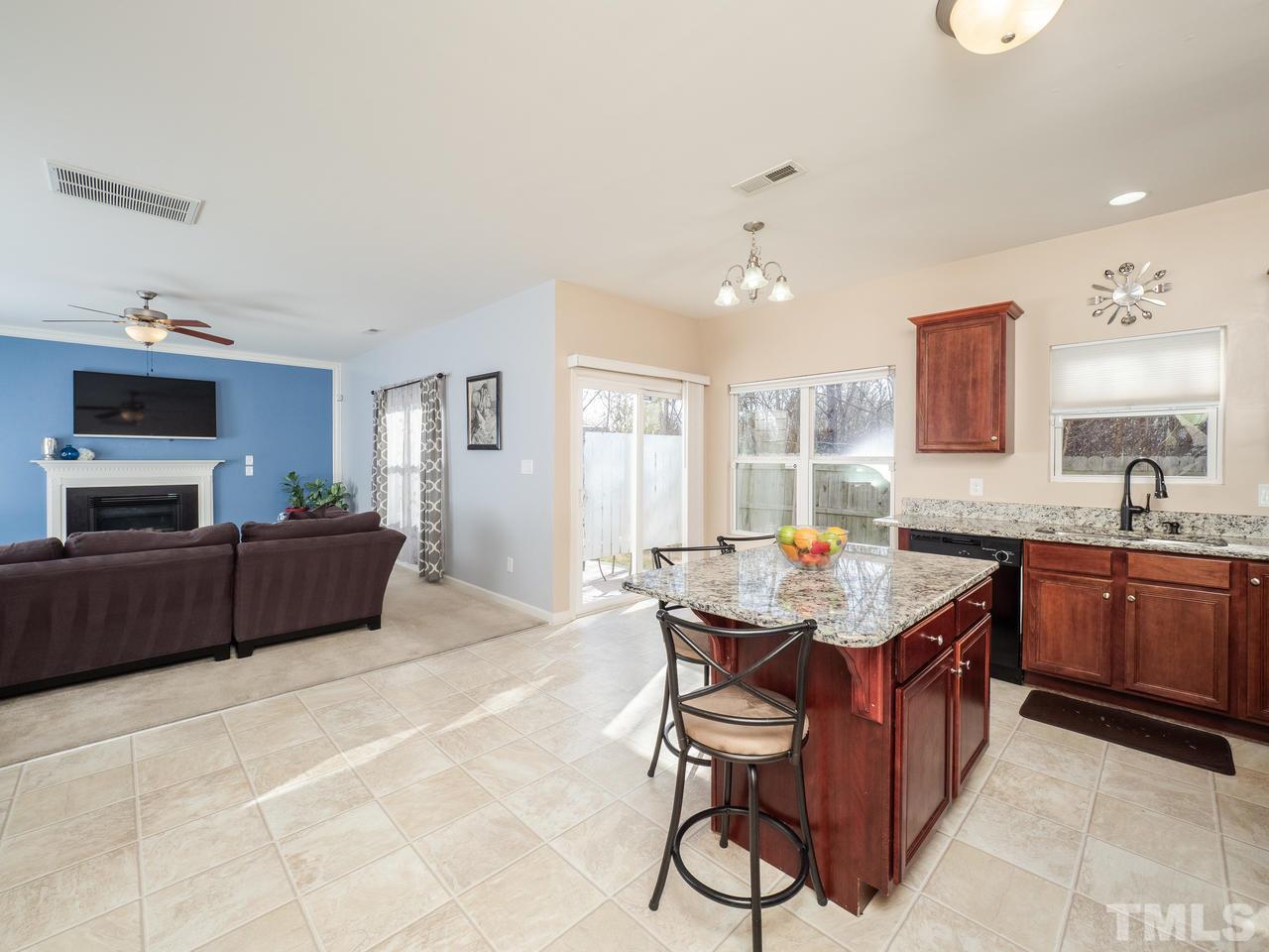 5624 Quitman Trail Raleigh, NC 27610 - Photo 13 of 25 a kitchen with a counter top space a sink stainless steel appliances and cabinets