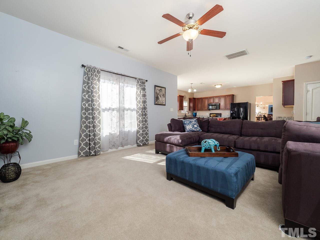 5624 Quitman Trail Raleigh, NC 27610 - Photo 15 of 25 a living room with furniture and window