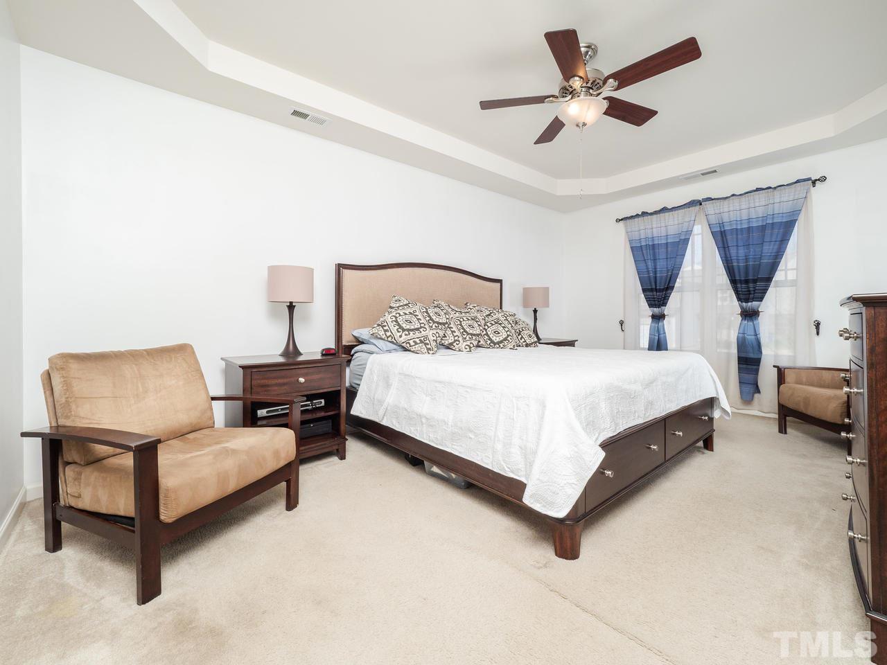 5624 Quitman Trail Raleigh, NC 27610 - Photo 16 of 25 a bedroom with a bed couch and a window