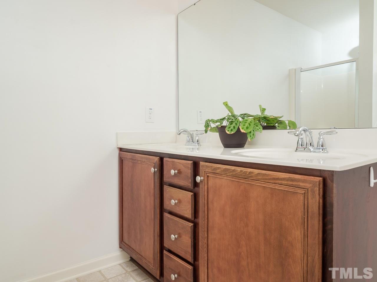 5624 Quitman Trail Raleigh, NC 27610 - Photo 18 of 25 a bathroom with a sink and a mirror