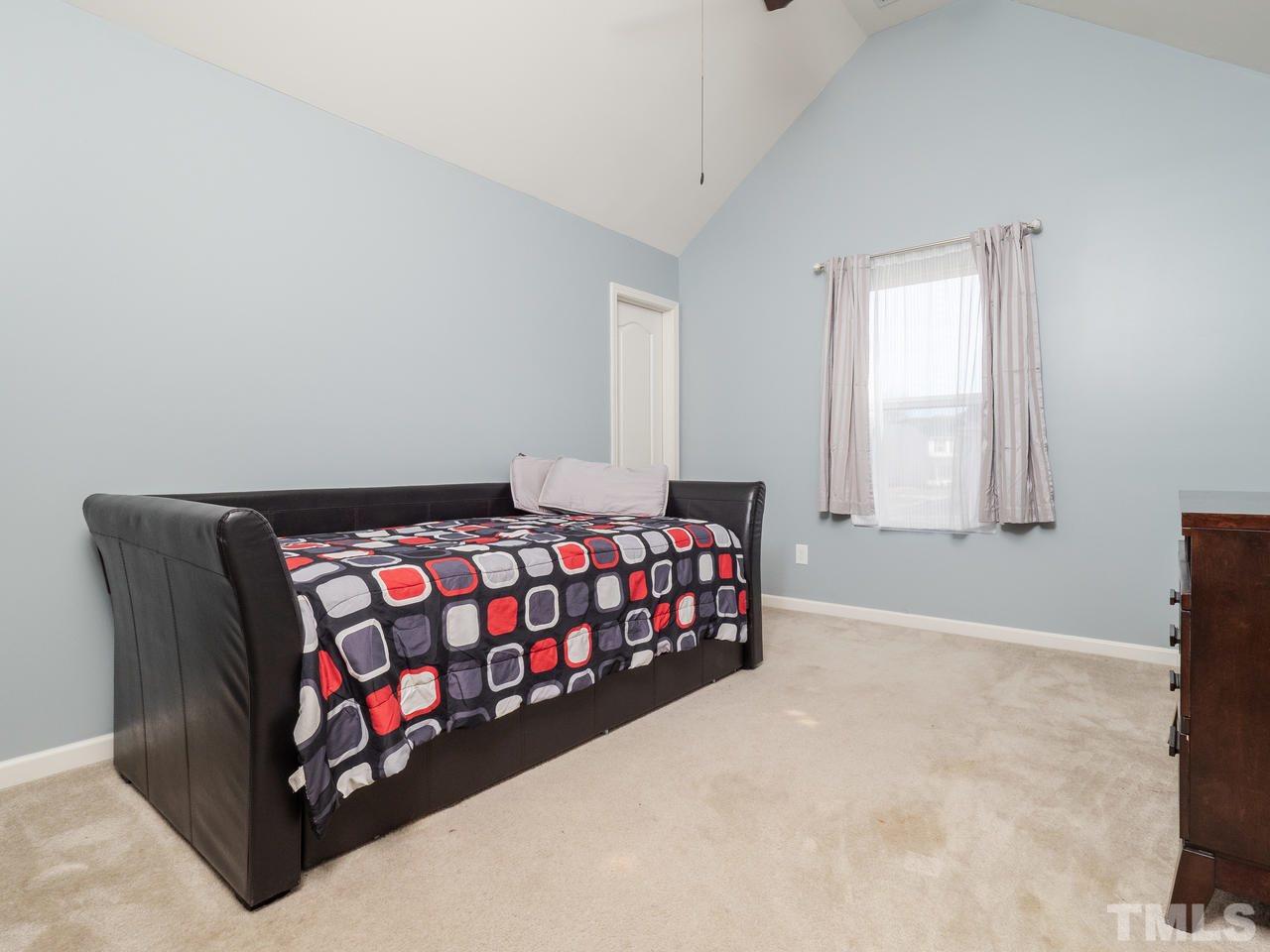 5624 Quitman Trail Raleigh, NC 27610 - Photo 21 of 25 a bedroom with a bed and window