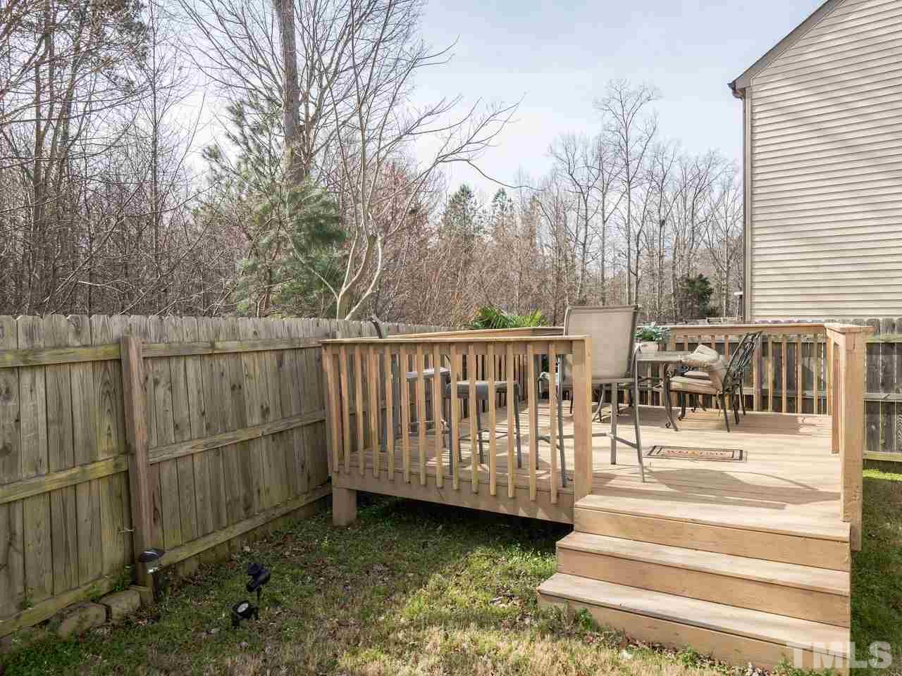 5624 Quitman Trail Raleigh, NC 27610 - Photo 23 of 25 a view of a chair and tables on the roof deck