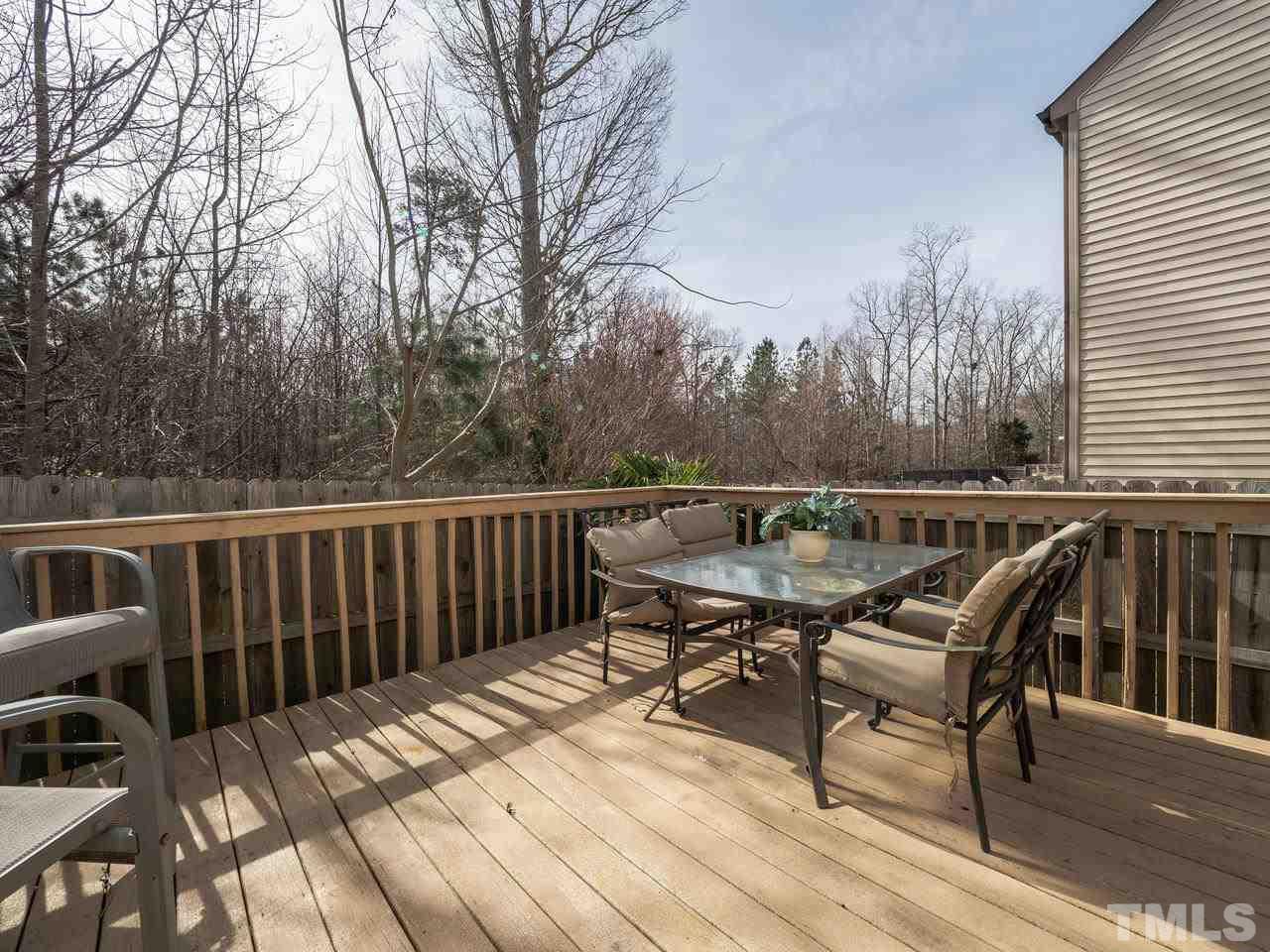 5624 Quitman Trail Raleigh, NC 27610 - Photo 24 of 25 a balcony with wooden floor table and chairs