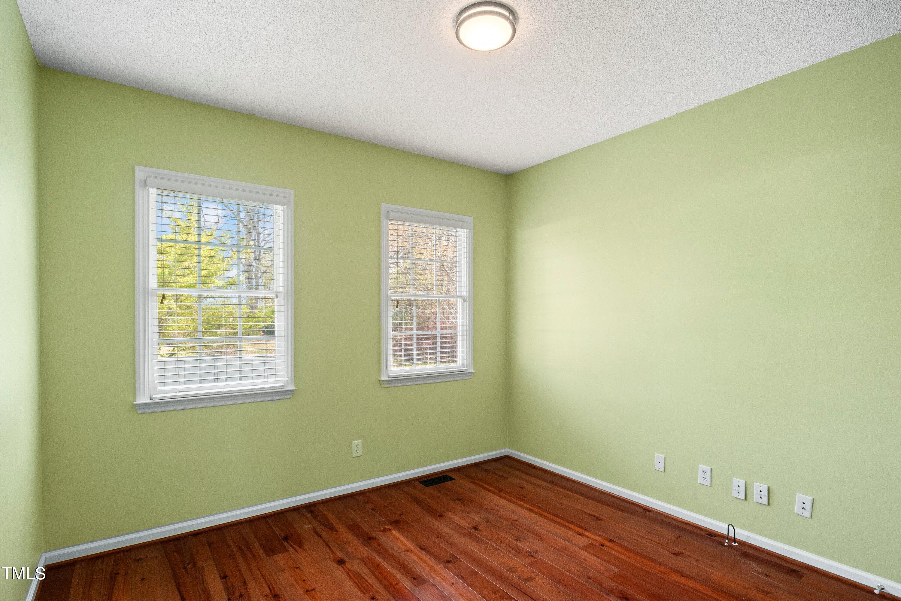 671 Old Evans Road Garner, NC 27529 - Photo 28 of 44 a view of a room with wooden floor and fan