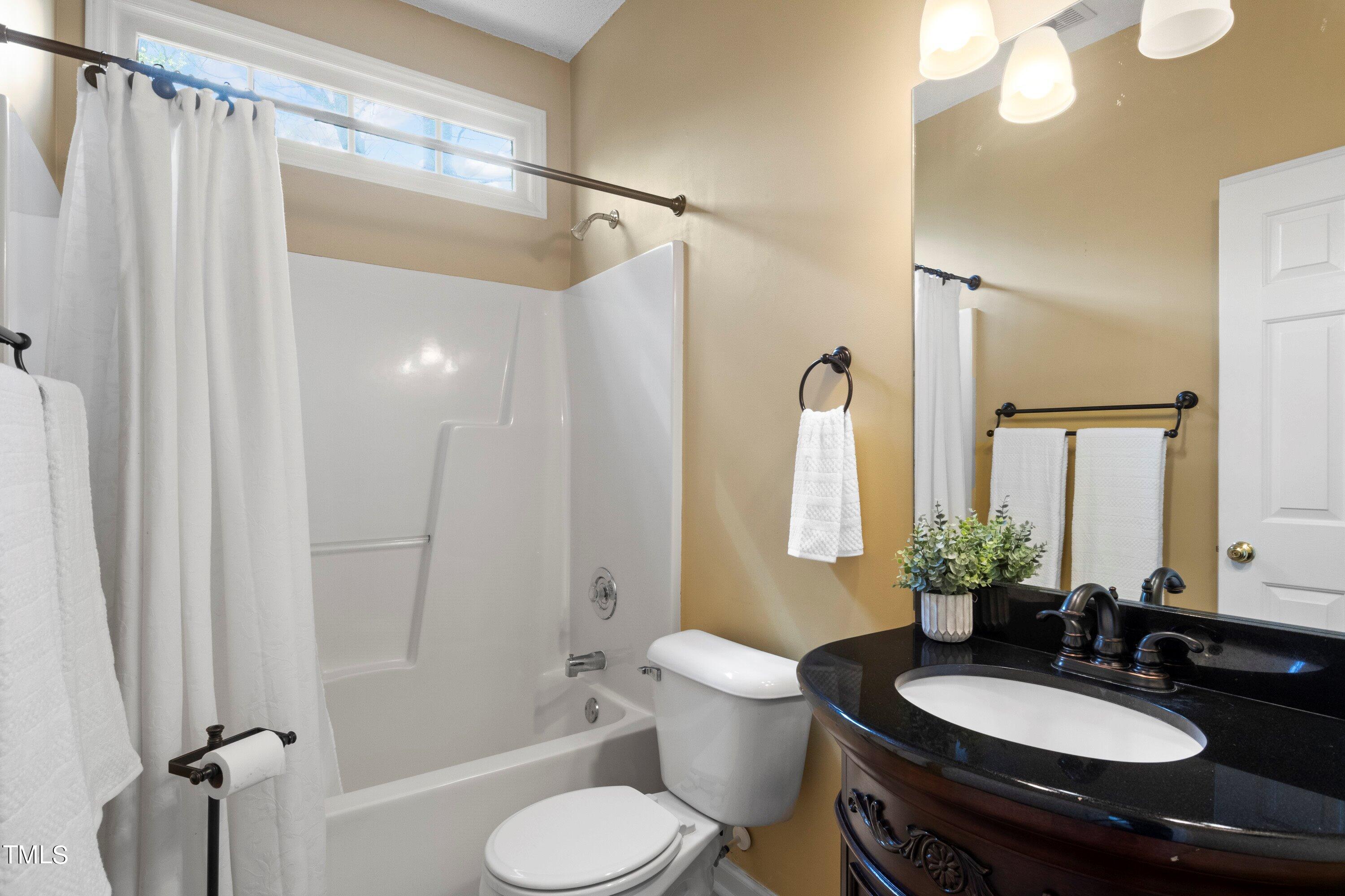 671 Old Evans Road Garner, NC 27529 - Photo 29 of 44 a bathroom with a sink toilet and shower