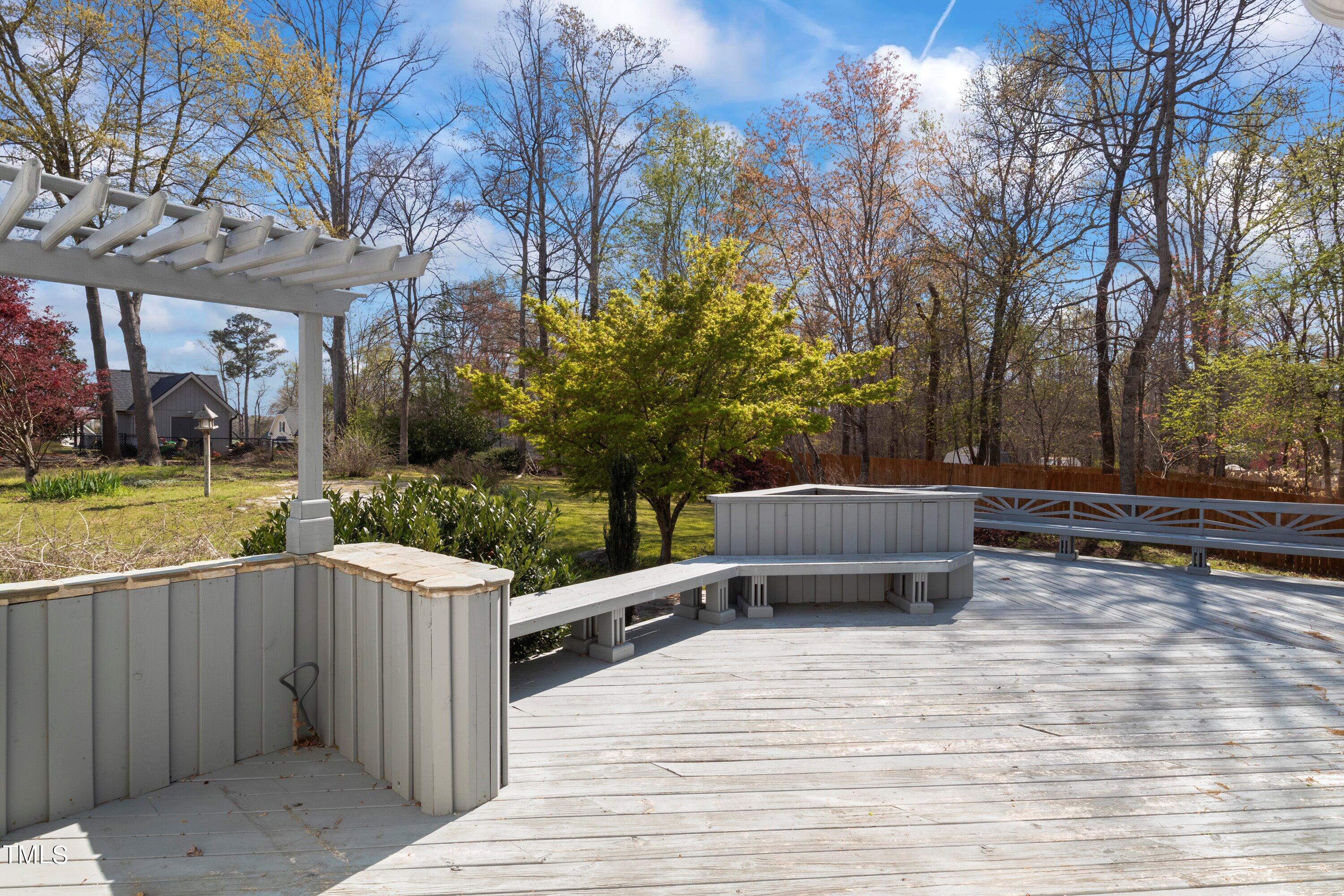 671 Old Evans Road Garner, NC 27529 - Photo 31 of 44 a view of a terrace with a yard