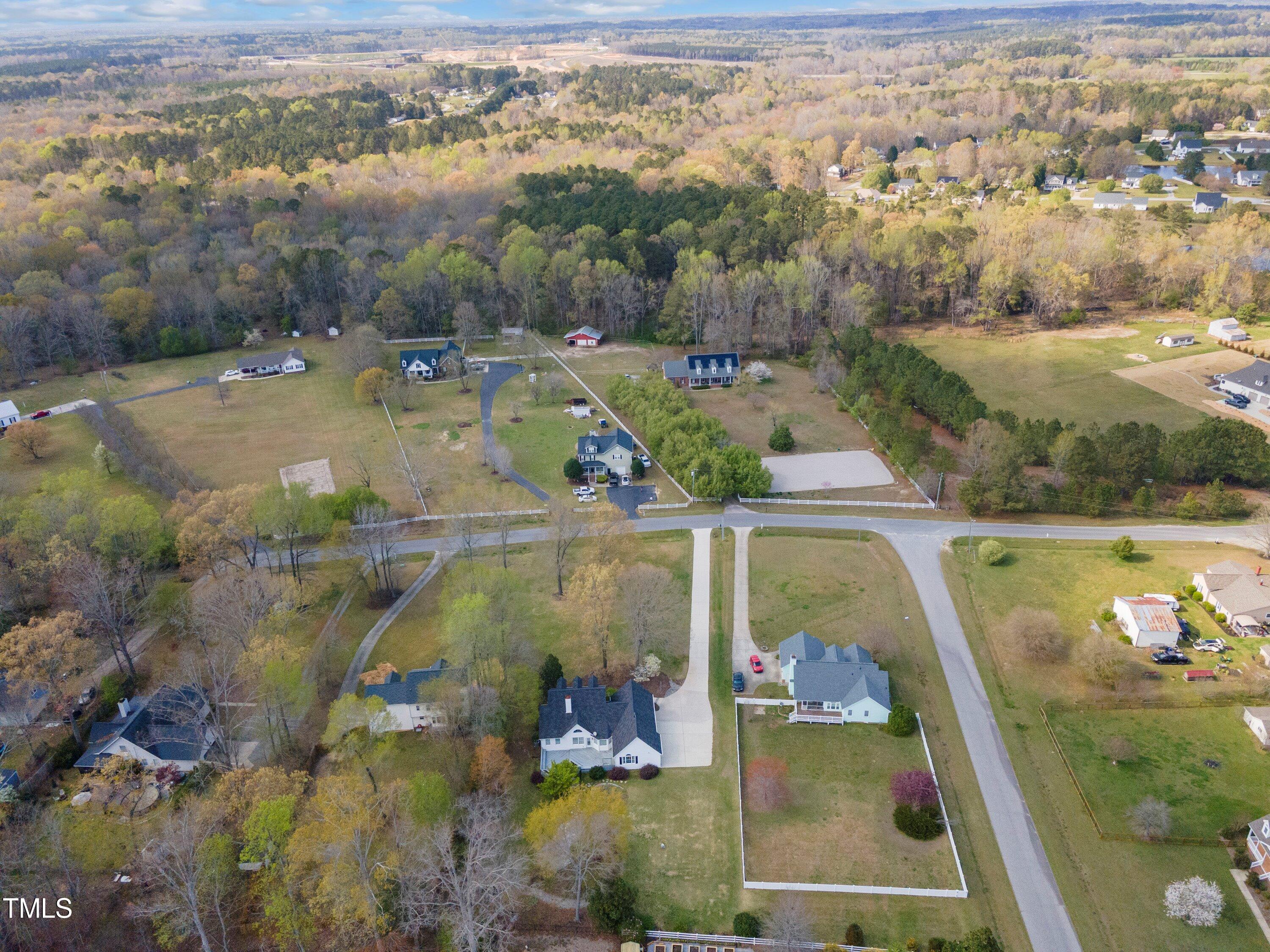 671 Old Evans Road Garner, NC 27529 - Photo 43 of 44 an aerial view of residential houses with outdoor space
