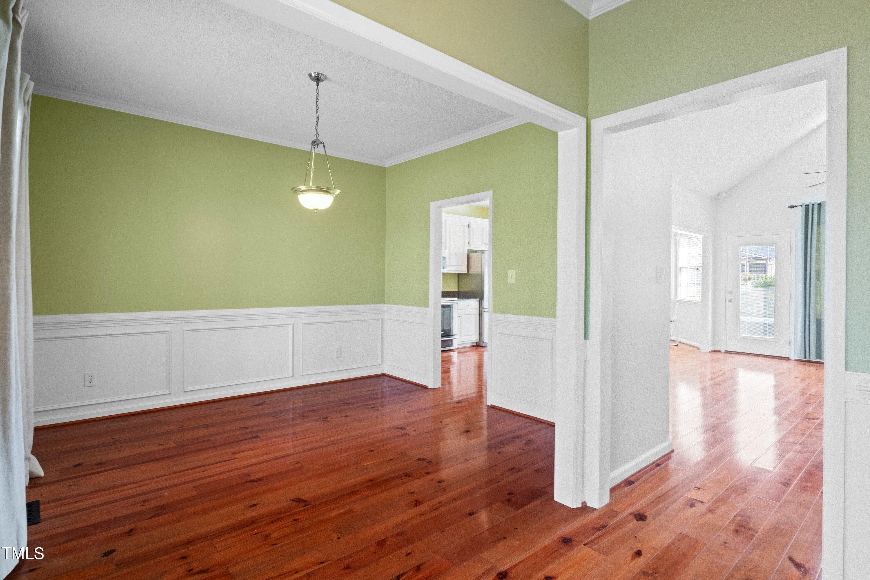 671 Old Evans Road Garner, NC 27529 - Photo 6 of 44 a view of a room with wooden floor