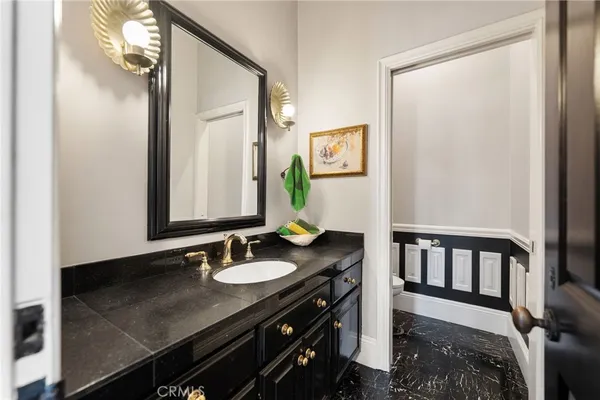 a dining hall with stainless steel appliances granite countertop furniture and a fireplace