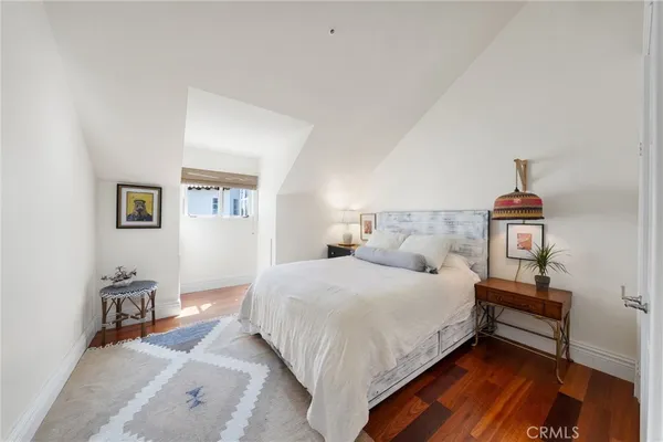 a living room with furniture large window and a fireplace