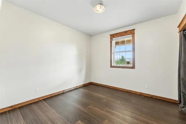 a bathroom with a toilet and shower