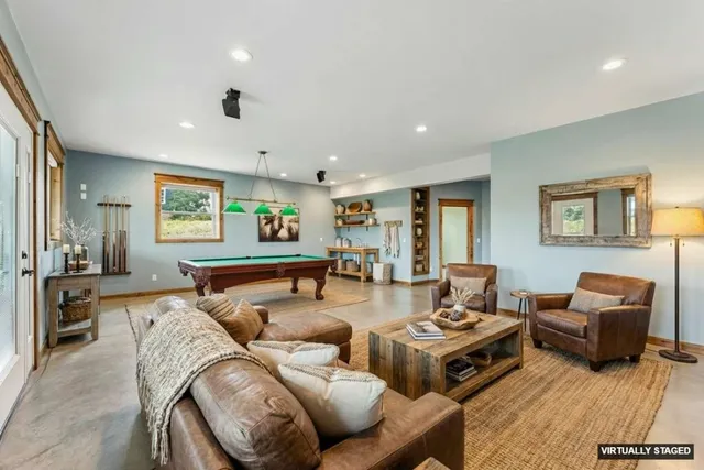 a bathroom with a granite countertop toilet a sink and a mirror