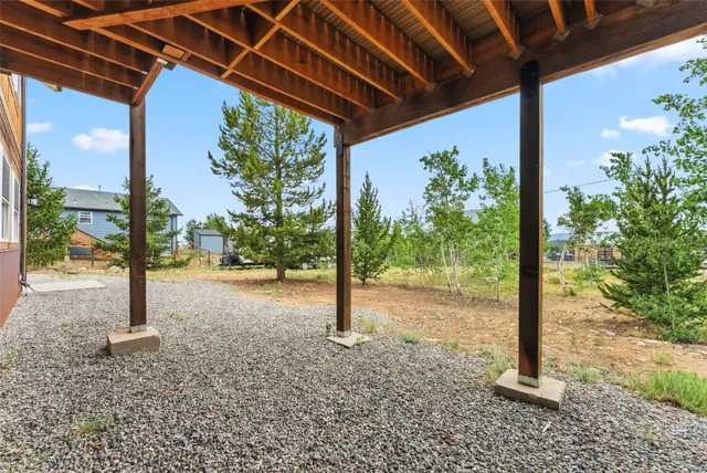 a view of a porch with furniture and yard