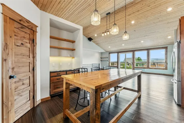 a kitchen with a stove and a window