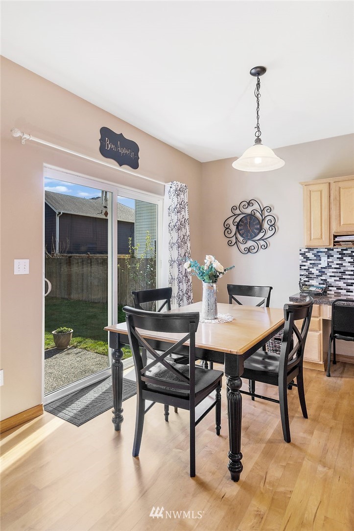 3124 172 Street Southeast Bothell, WA 98012 - Photo 14 of 25 a view of a dining room with furniture