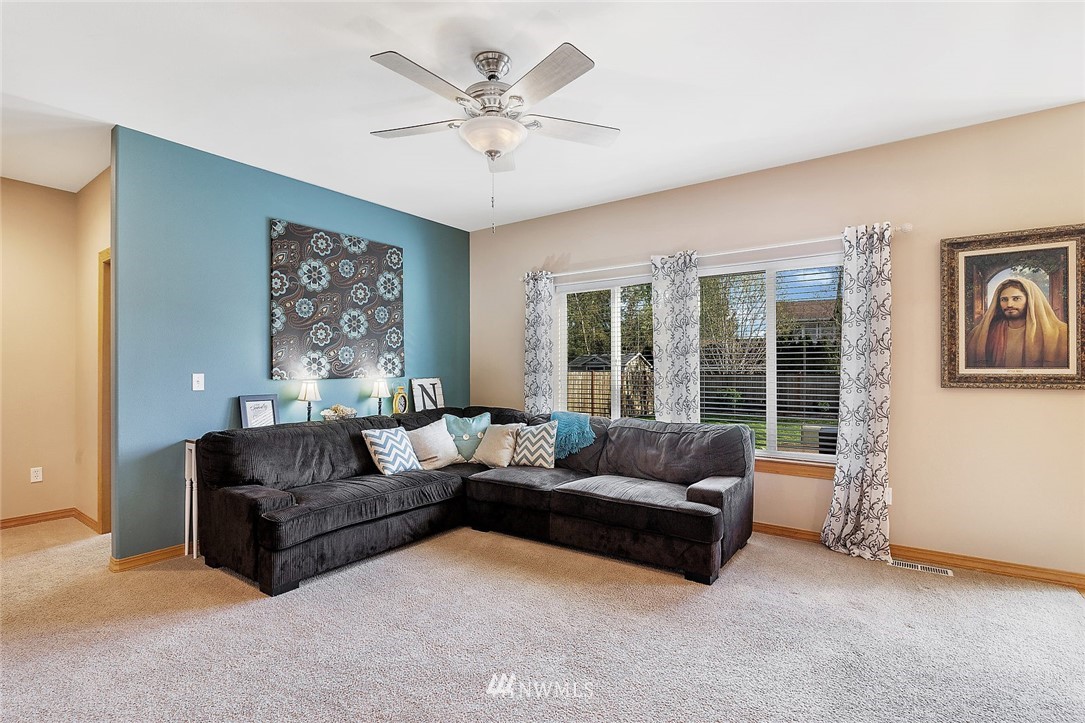 3124 172 Street Southeast Bothell, WA 98012 - Photo 15 of 25 a living room with furniture and a large window
