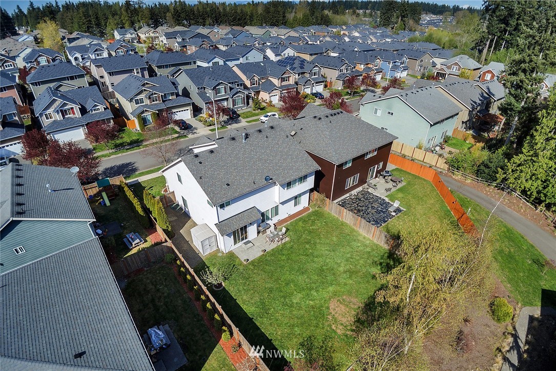 3124 172 Street Southeast Bothell, WA 98012 - Photo 3 of 25 an aerial view of a house with a garden and lake view