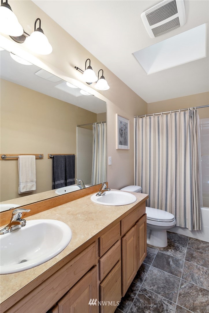 3124 172 Street Southeast Bothell, WA 98012 - Photo 22 of 25 a bathroom with a sink and a mirror
