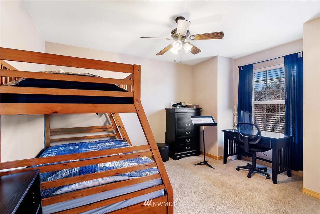 3124 172 Street Southeast Bothell, WA 98012 - Photo 24 of 25 a view of a workspace with furniture and a window