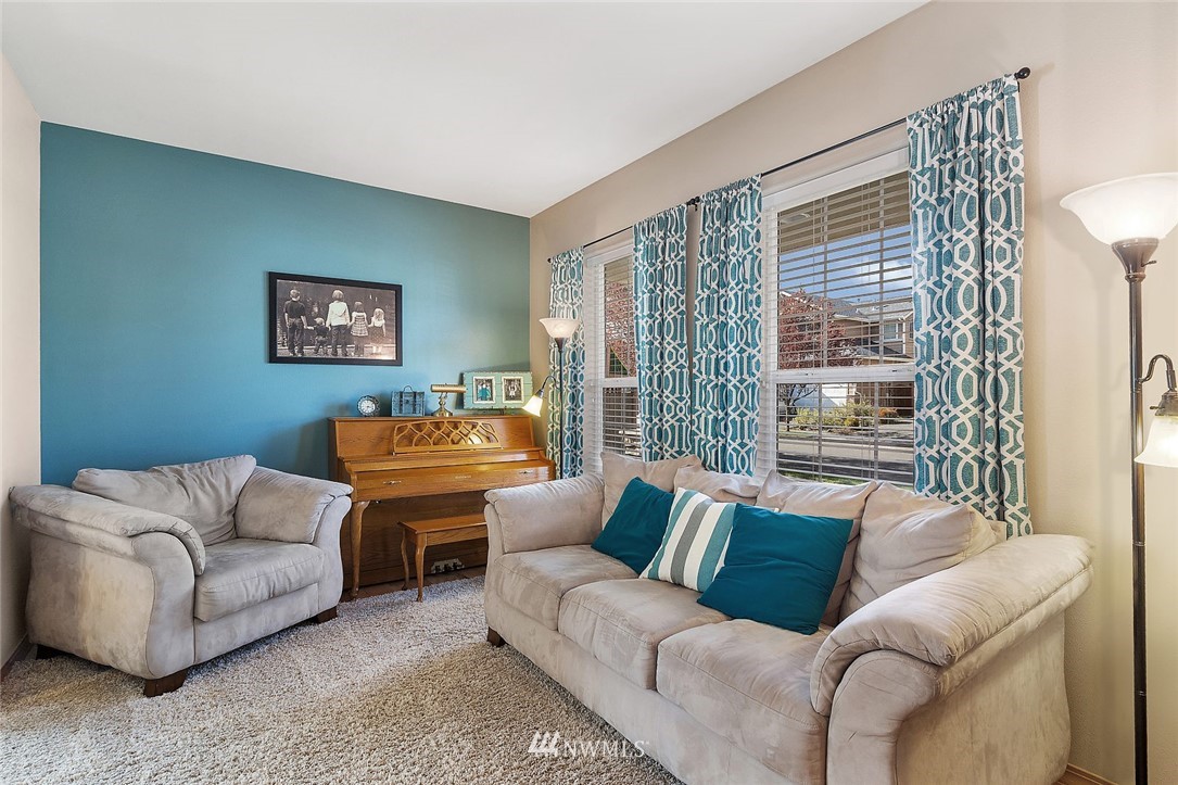 3124 172 Street Southeast Bothell, WA 98012 - Photo 8 of 25 a living room with furniture and a large window