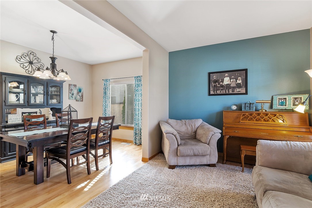 3124 172 Street Southeast Bothell, WA 98012 - Photo 9 of 25 a living room with furniture and a wooden floor
