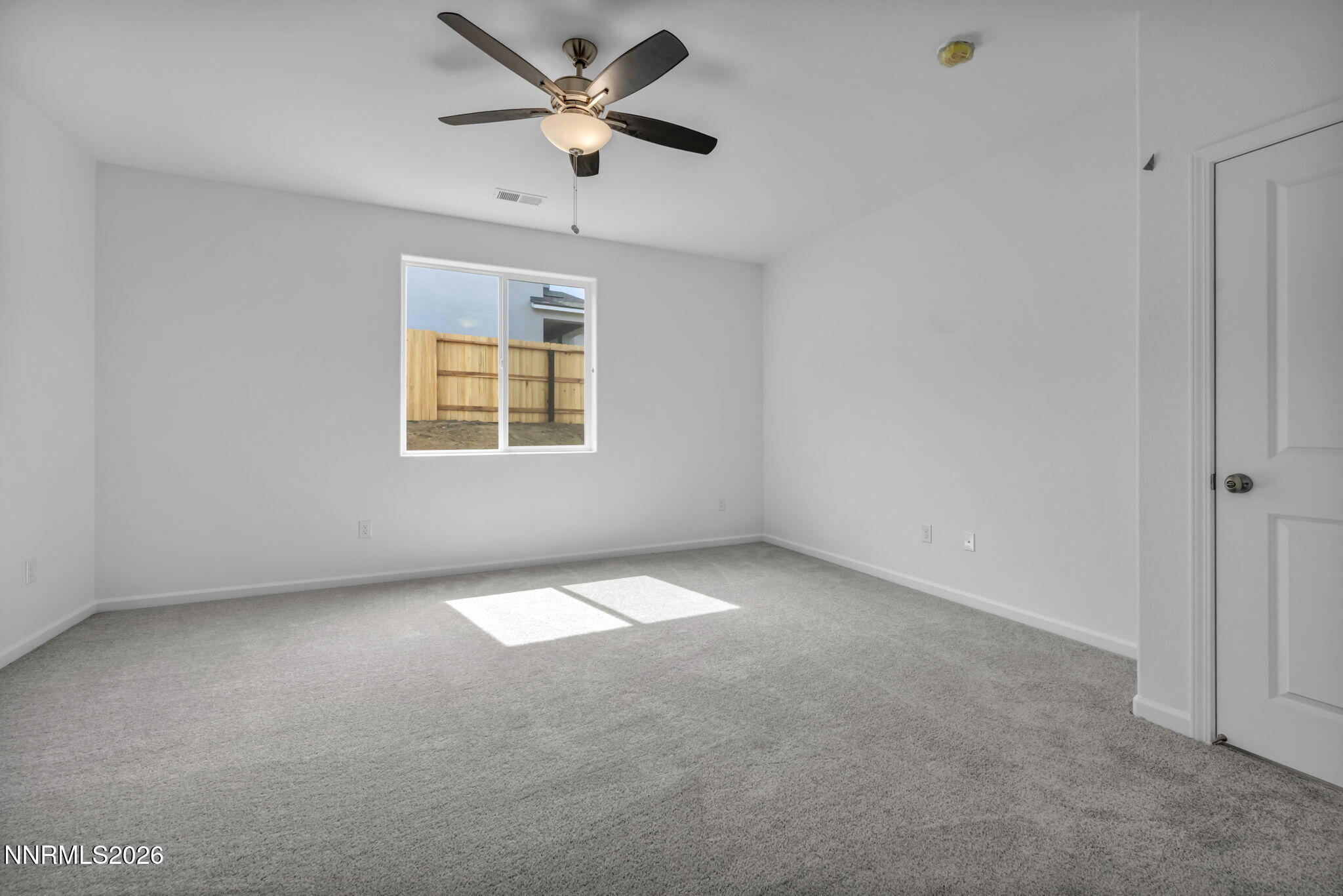 8500 Wicket Drive, Unit LOT 44 Reno, NV 89506 - Photo 16 of 31 an empty room with a window and a fan